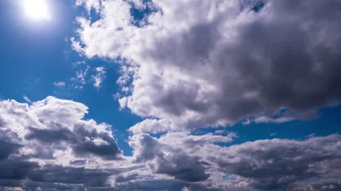 Clouds Moving Under the Bright Sun in the Blue Sky, Timelapse Stock Footage 218023131