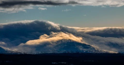 Clouds moving like water over the mountains. Stock Footage 123084574