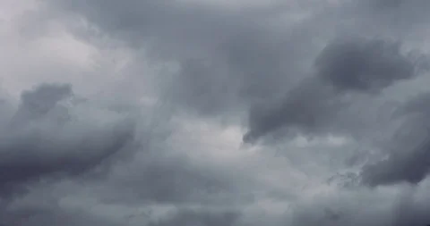 Clouds moving by the wind quickly fly above the ground. Stock Footage 116187998