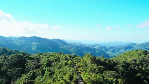 Clouds naturally moving through tropical mountain landscape Video stock 256021203
