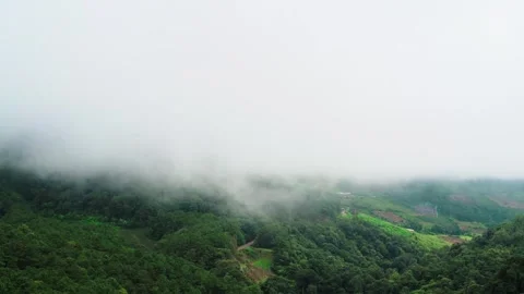 Clouds naturally moving through tropical mountain landscape Video stock 256025123