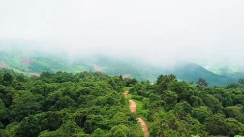 Clouds naturally moving through tropical mountain landscape Video stock 256025261