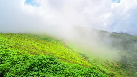 Clouds naturally moving through tropical mountain landscape Video stock 256026175
