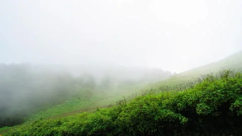 Clouds naturally moving through tropical mountain landscape Video stock 256026246