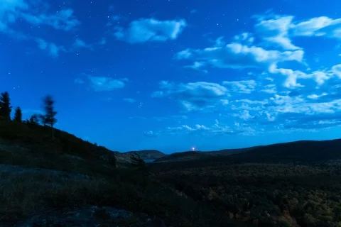 Clouds at night over ravine 스톡 동영상 128654867