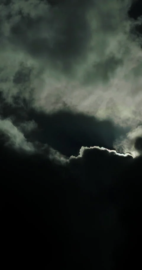 Clouds in night sky with flashes of lightning illuminating dark atmosphere and Stock Footage 321990496