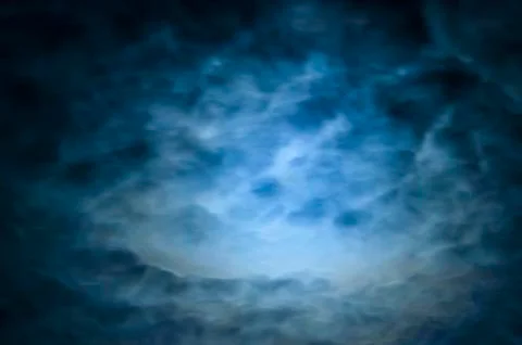 Clouds in the night sky Stock Photos