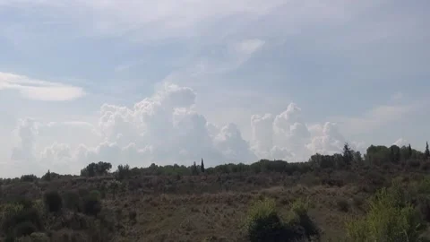 Clouds nimbus sky sunlight weather storm countryside nature plants noon zoom Stock Footage 333581027