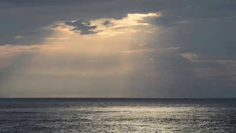 The clouds open and let the sun's rays pass after a storm Stock Footage 83389834