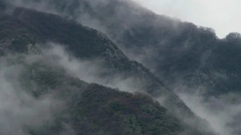 Clouds or fog moving on a mountain Stock Footage 94597160
