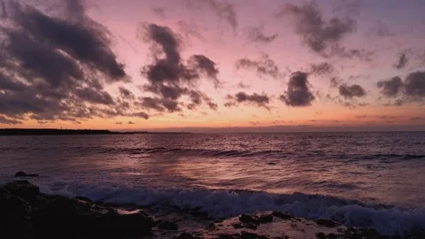 Clouds with orange, purple and black colors at sunset sky Video stock 125812962