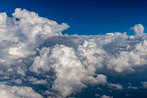 Clouds outside the airplane window. White clouds, View of the sky above the c Stock Photos