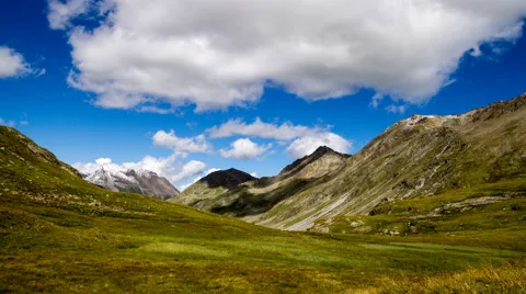 Clouds over alpine mountains time lapse Stock Footage 68910834