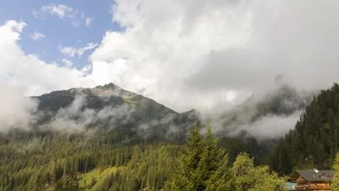 Clouds over alpine mountains time lapse Stock Footage 140863082