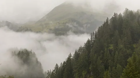 Clouds over alpine mountains time lapse Stock Footage 140897771