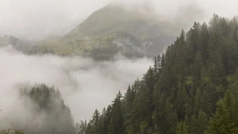 Clouds over alpine mountains time lapse Stock Footage 140898112