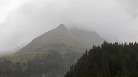 Clouds over alpine mountains time lapse Видео 140899090