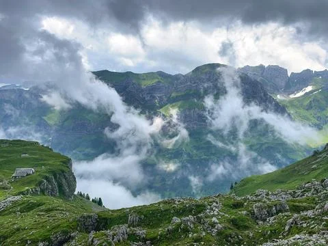 Clouds Over Alpine Peaks Stock Photos