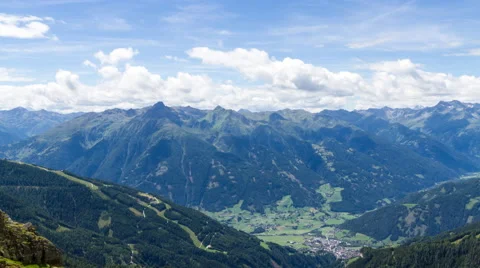 Clouds over alpine valley and mountains time lapse Stock Footage 68909148