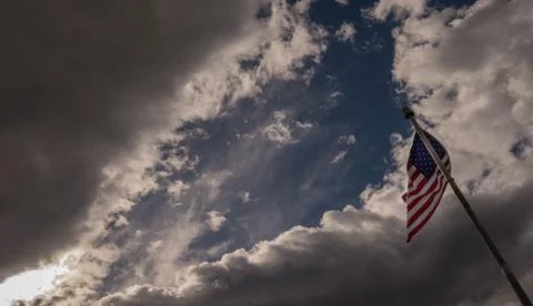 Clouds over american flag Stock Photos