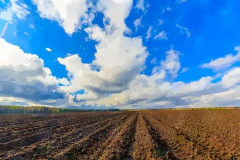 Clouds over arable land close-up. Watercolor illustration. Time Lapse.. Stock Illustration