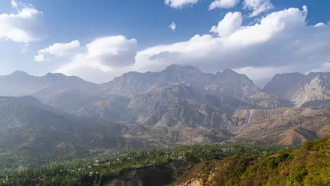 Clouds over the Arslanbob mountains and valley. 库存影片 265059037