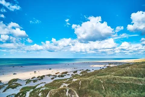 Clouds over the beach at the Jammerbugt in norther Jutland in Denmark Stock Photos