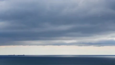 Clouds over the blue sea timelapse. Video stock 234068149