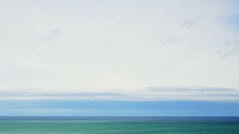 Clouds over the blue sea timelapse. Video stock 234068168