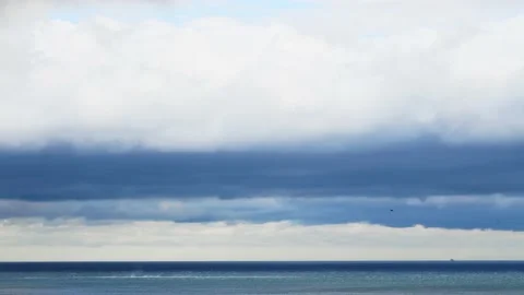 Clouds over the blue sea timelapse. Video stock 234068207