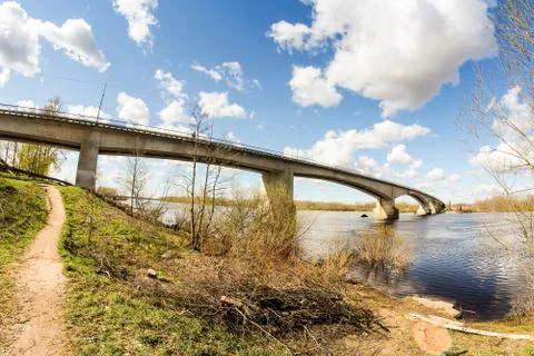 Clouds over the bridge over the river. Photos