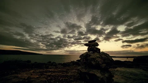 Clouds over cairn, timelapse Video stock 178609057