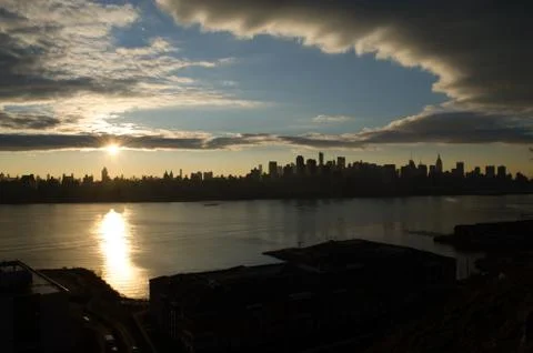 Clouds over city Stock Photos