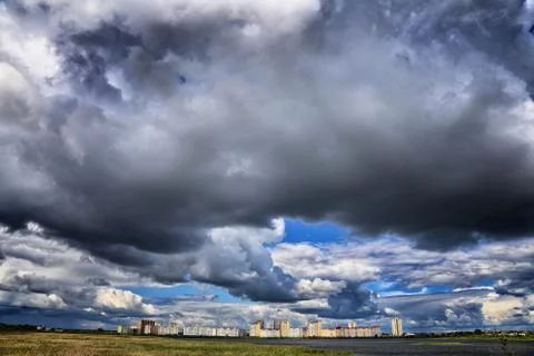 Clouds over the city Stock Photos