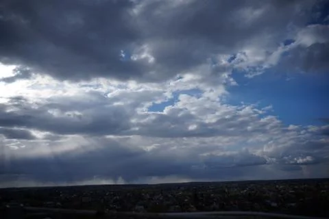 Clouds over the city Stock Photos