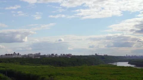 Clouds over the city, the river and the wood Stock Footage 10953370