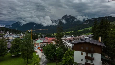 Clouds over Cortina d'Ampezzo - Rain incoming - Timelapse - 4K Stock Footage 205543567