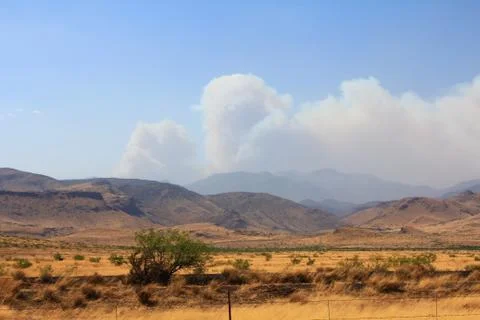 Clouds over the desert mountain landscape (HD)c Stock Photos