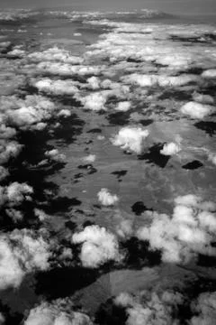 Clouds over desert from the sky Stock Photos
