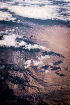 Clouds over desert from the sky Stock Photos
