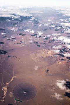 Clouds over desert from the sky Stock Photos