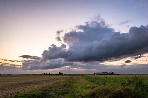 Clouds over desolate landscape Stock Photos
