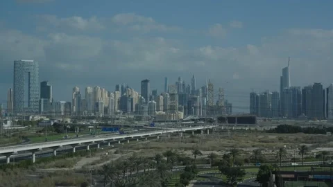 Clouds over Dubai, daytime timelapse of traffic, metro and clouds Video stock 331728769