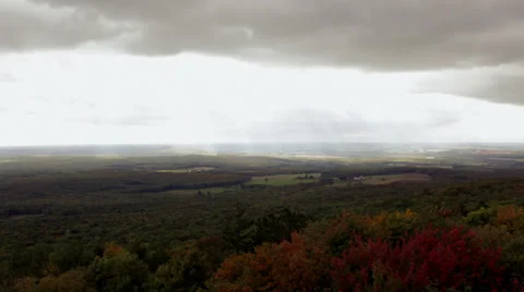 Clouds over expansive farmland Stock Footage 31650796