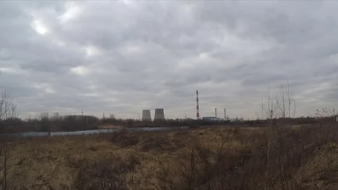 Clouds over factory pipes in spring timelapse Stock Footage 77285103