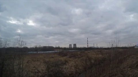 Clouds over factory pipes in the spring timelapse Stock Footage 77285465