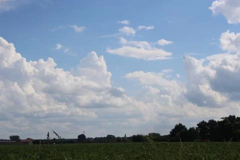 Clouds over a field Stock Photos