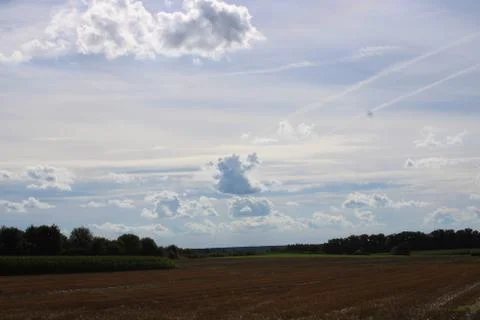 Clouds over a field Stock Photos