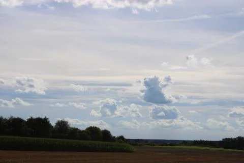 Clouds over a field Stock Photos