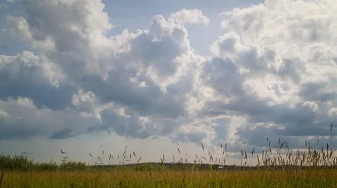 Clouds over the field Stock Photos